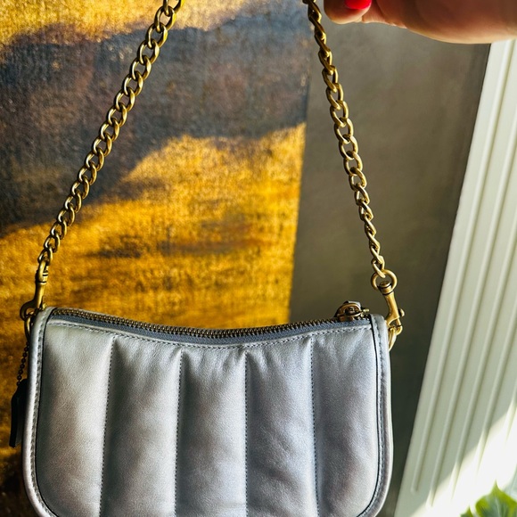 Coach wristlet in silver puffy leather with gold hardware. - Picture 6 of 7